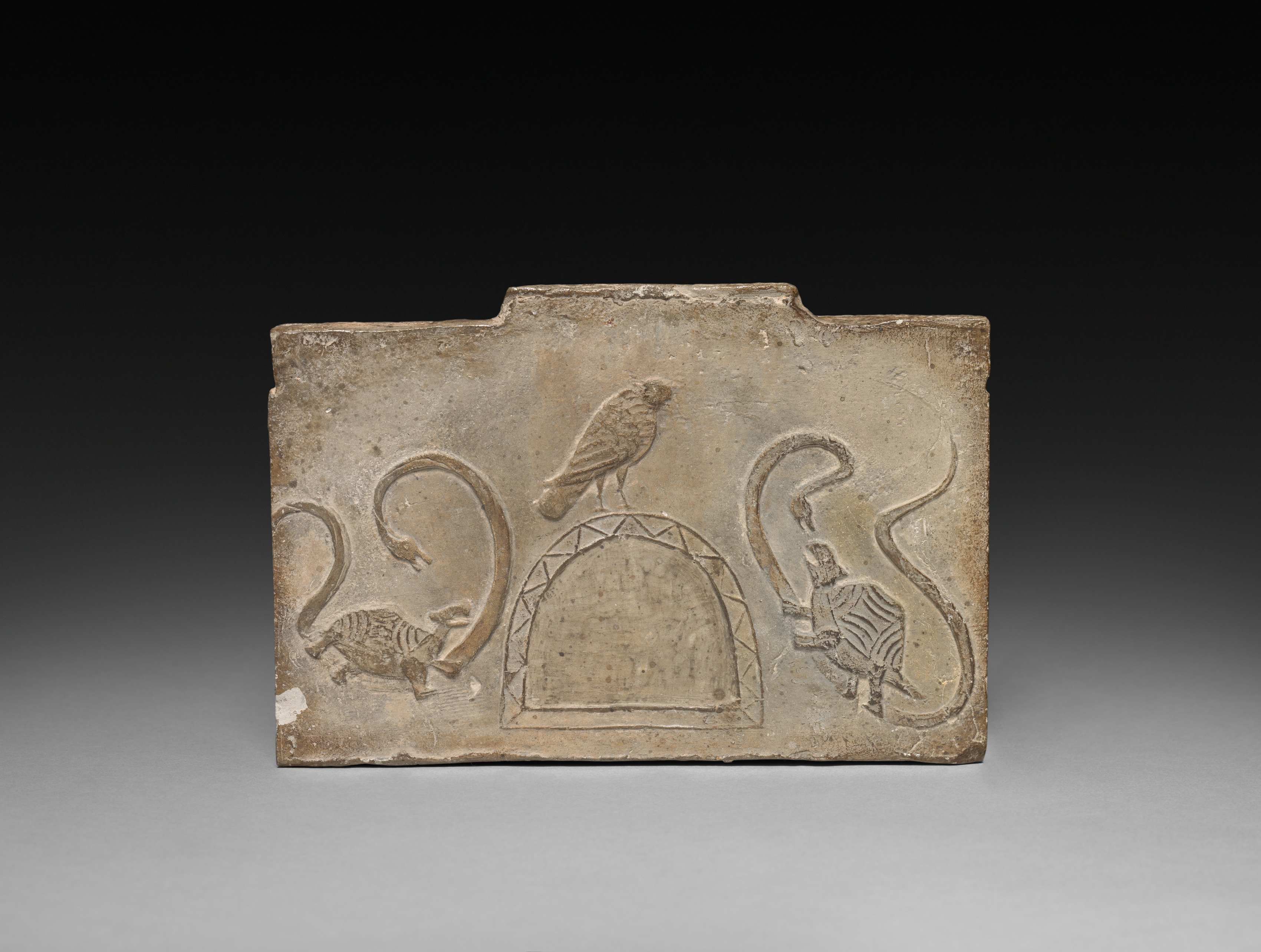 Panel from Model Cooking Stove: Raven Flanked by Snake-Entwined Tortoises, Unknown